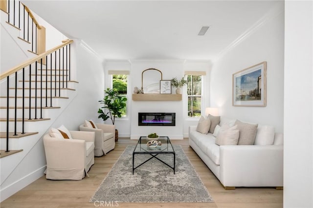 308 Via El Patio, San Clemente, CA 92673 - living area with ornamental molding, wood finished floors, stairs, and a glass covered fireplace