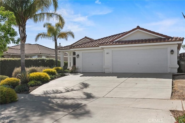 235 Cornuta Way, Nipomo, CA 93444 - view of front of house with an attached garage, a tiled roof, concrete driveway, and stucco siding