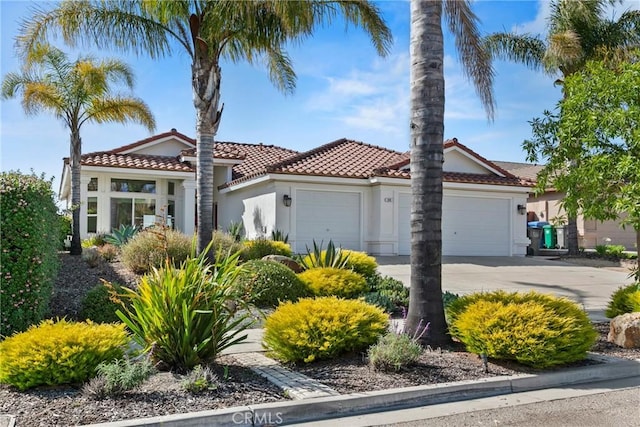 235 Cornuta Way, Nipomo, CA 93444 - mediterranean / spanish house with an attached garage, stucco siding, concrete driveway, and a tile roof