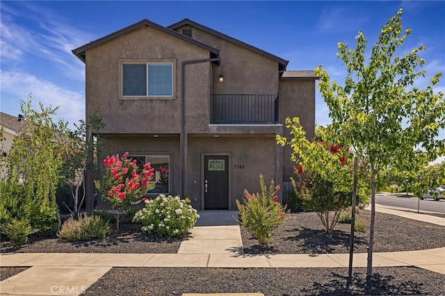 2740 Levi Ln, Chico, CA 95973 - view of front facade with a balcony and stucco siding