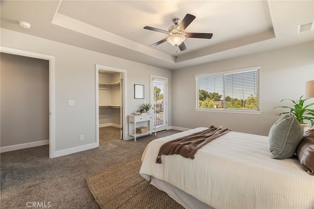 2740 Levi Ln, Chico, CA 95973 - bedroom with a raised ceiling, a spacious closet, carpet, a ceiling fan, and a closet
