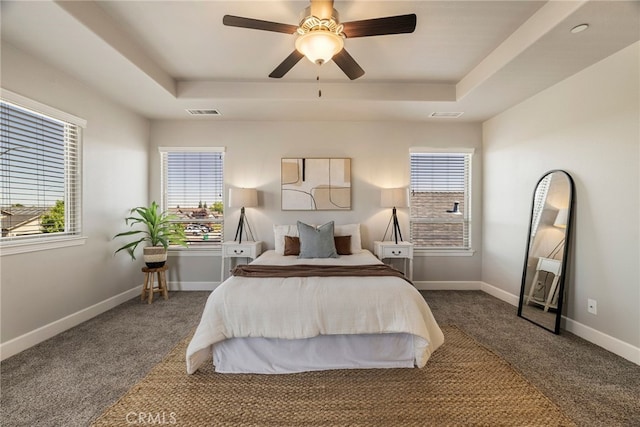 2740 Levi Ln, Chico, CA 95973 - carpeted bedroom with a tray ceiling, multiple windows, and ceiling fan