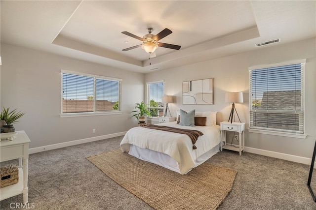 2740 Levi Ln, Chico, CA 95973 - carpeted bedroom with a tray ceiling and ceiling fan