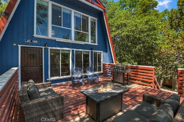 1351 Silverado Rd, Big Bear City, CA 92314 - rear view of house featuring a fire pit, a deck, and board and batten siding