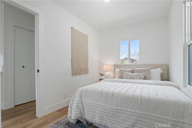 9525 Holmes Ave, Los Angeles, CA 90002 - bedroom featuring wood finished floors and baseboards