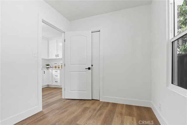 9525 Holmes Ave, Los Angeles, CA 90002 - spare room with light wood-type flooring and baseboards