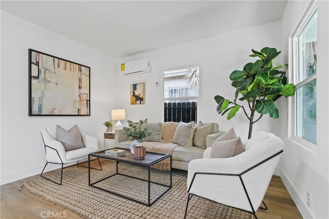 9525 Holmes Ave, Los Angeles, CA 90002 - living area featuring a wall unit AC and wood finished floors