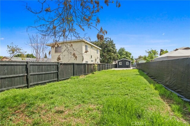 9525 Holmes Ave, Los Angeles, CA 90002 - fenced backyard with a storage shed