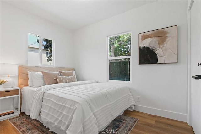 9525 Holmes Ave, Los Angeles, CA 90002 - bedroom with wood finished floors and baseboards