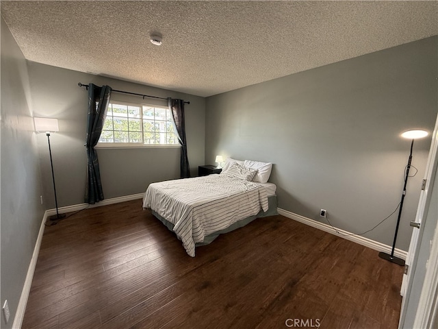 21841 Zuni Dr, Lake Forest, CA 92630 - bedroom with dark wood-type flooring and a textured ceiling