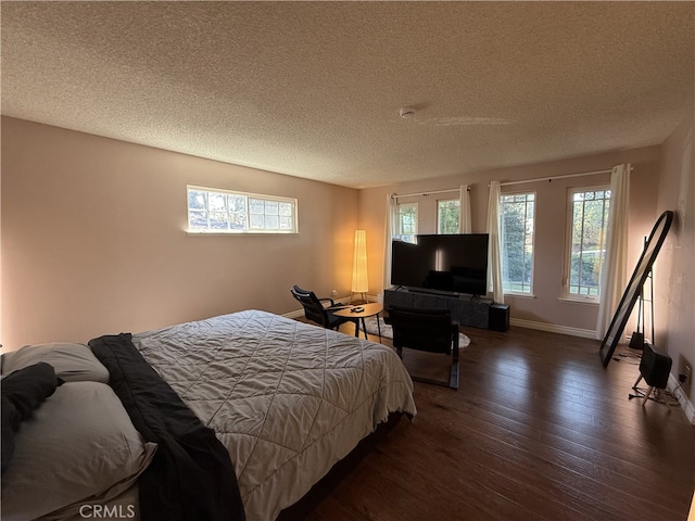 21841 Zuni Dr, Lake Forest, CA 92630 - bedroom with wood finished floors, multiple windows, and a textured ceiling