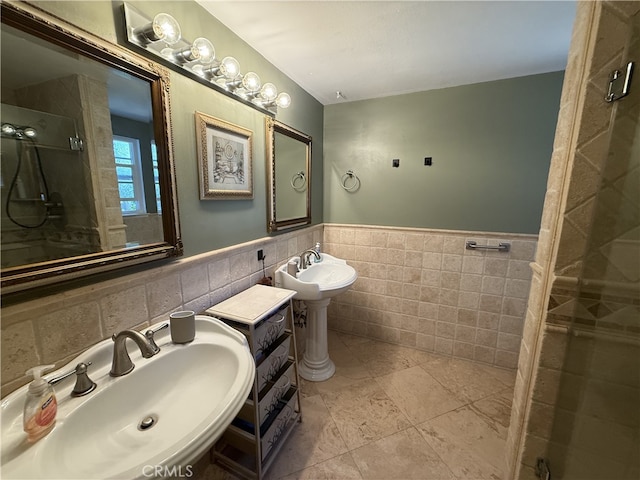 21841 Zuni Dr, Lake Forest, CA 92630 - bathroom featuring tile walls, a shower stall, wainscoting, and tile patterned floors