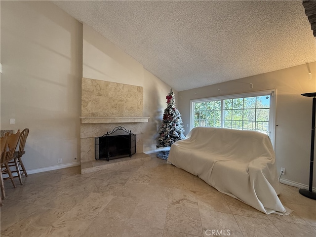 21841 Zuni Dr, Lake Forest, CA 92630 - living room featuring a textured ceiling, lofted ceiling, and a tiled fireplace