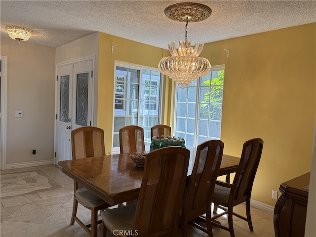 21841 Zuni Dr, Lake Forest, CA 92630 - dining space featuring a textured ceiling and a chandelier