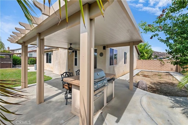 31139 Little Camille Way, Menifee, CA 92584 - fenced backyard with a patio area, exterior kitchen, and a ceiling fan