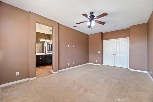 31139 Little Camille Way, Menifee, CA 92584 - unfurnished bedroom featuring light carpet, ensuite bathroom, a closet, and ceiling fan