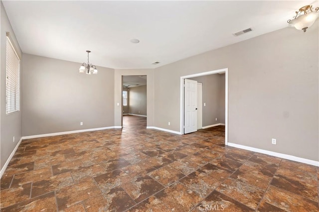 31139 Little Camille Way, Menifee, CA 92584 - empty room with a chandelier and stone finish flooring