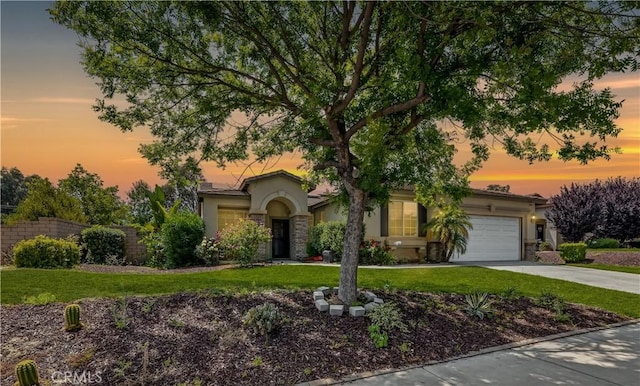 31139 Little Camille Way, Menifee, CA 92584 - obstructed view of property featuring stucco siding, an attached garage, concrete driveway, and a front yard