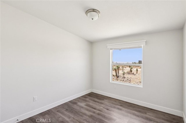 537 Calaveras Rd, Pinon Hills, CA 92372 - unfurnished room with baseboards and dark wood-style flooring