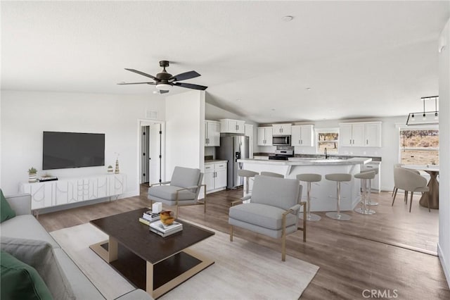 537 Calaveras Rd, Pinon Hills, CA 92372 - living room with lofted ceiling, wood finished floors, and a ceiling fan