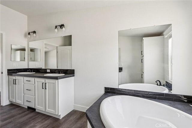 537 Calaveras Rd, Pinon Hills, CA 92372 - full bath with a garden tub, double vanity, and wood finished floors
