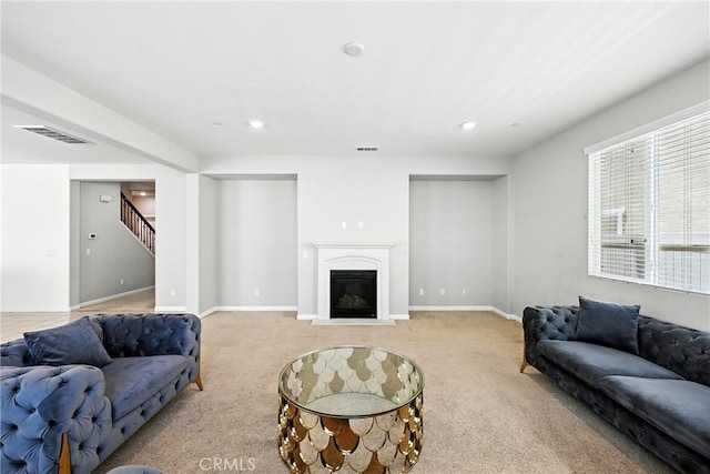 6212 Athena St, Chino, CA 91710 - carpeted living area with stairs, recessed lighting, and a glass covered fireplace