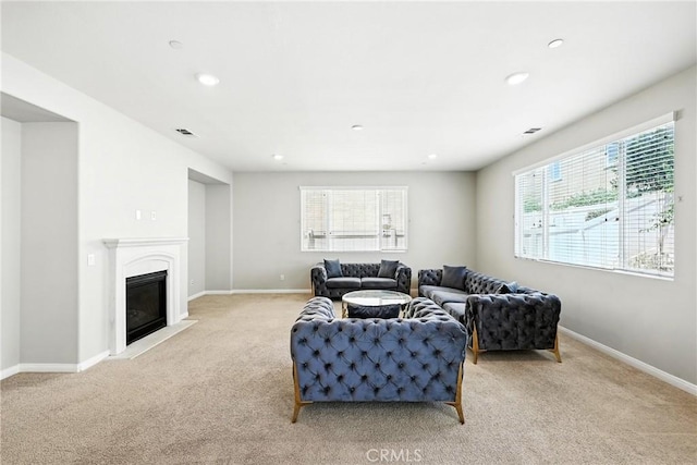 6212 Athena St, Chino, CA 91710 - living room featuring light colored carpet, plenty of natural light, recessed lighting, and a glass covered fireplace