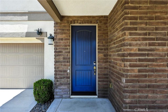 6212 Athena St, Chino, CA 91710 - entrance to property featuring a garage and brick siding