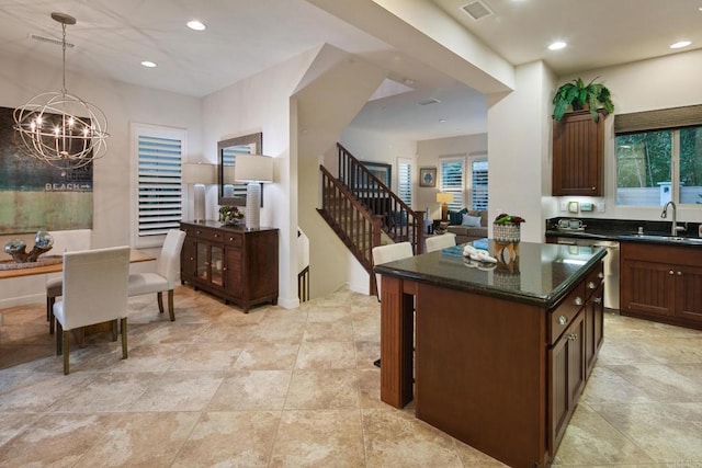 674 Calypso Pl, Encinitas, CA 92024 - kitchen featuring a chandelier, a center island, plenty of natural light, dark stone counters, and recessed lighting