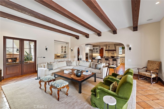 1 Overlook Dr, Ladera Ranch, CA 92694 - living room with arched walkways, beamed ceiling, french doors, and recessed lighting