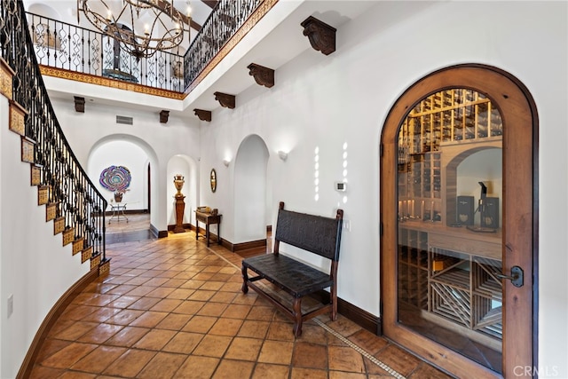 1 Overlook Dr, Ladera Ranch, CA 92694 - entryway with arched walkways, a high ceiling, and stairs