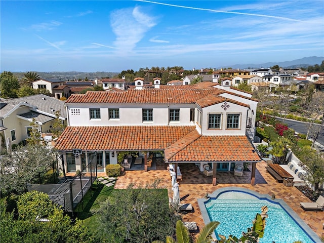 1 Overlook Dr, Ladera Ranch, CA 92694 - rear view of property with a tiled roof, a residential view, a fenced backyard, and stucco siding