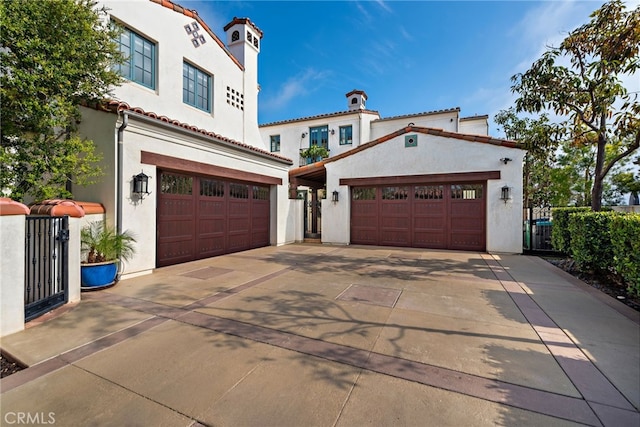 1 Overlook Dr, Ladera Ranch, CA 92694 - mediterranean / spanish home with stucco siding, driveway, an attached garage, and a tile roof