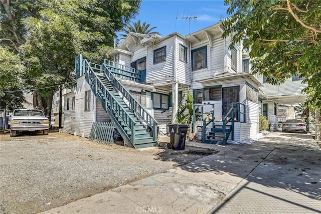 1470 W Adams Blvd, Los Angeles, CA 90007 - multi unit property featuring stairs and driveway