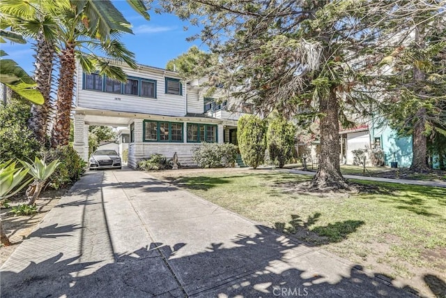 1470 W Adams Blvd, Los Angeles, CA 90007 - view of front facade featuring concrete driveway and a front lawn