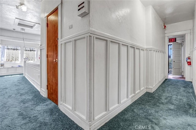1470 W Adams Blvd, Los Angeles, CA 90007 - hall featuring carpet flooring, a decorative wall, and a wainscoted wall