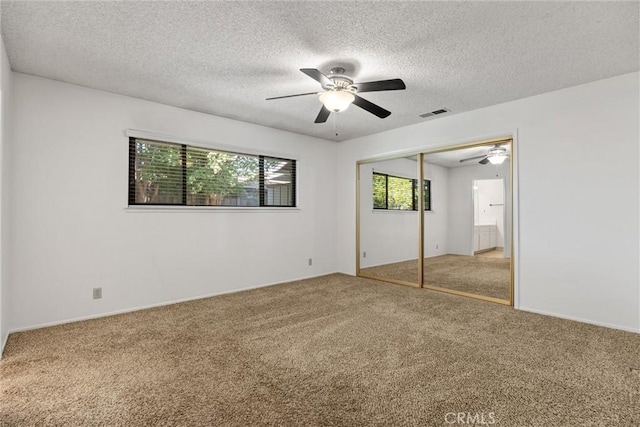 835 Madrone Ave, Chico, CA 95926 - unfurnished bedroom with carpet floors, a textured ceiling, a closet, and ceiling fan
