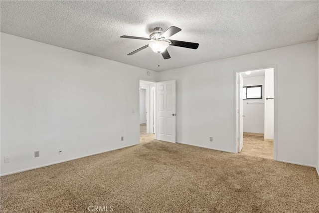 835 Madrone Ave, Chico, CA 95926 - unfurnished bedroom with light carpet, a textured ceiling, a spacious closet, and ceiling fan