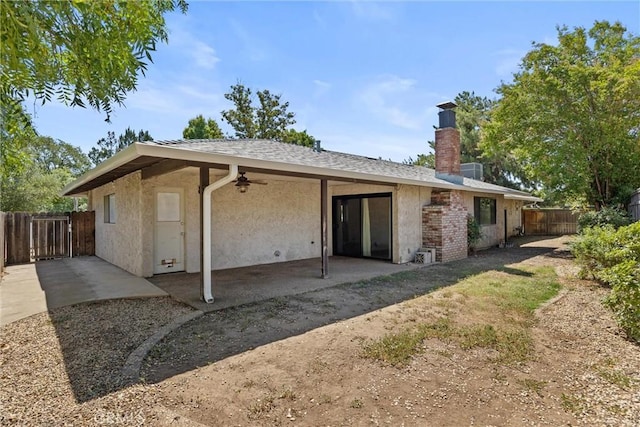 835 Madrone Ave, Chico, CA 95926 - rear view of house featuring ceiling fan, a chimney, a patio, and stucco siding