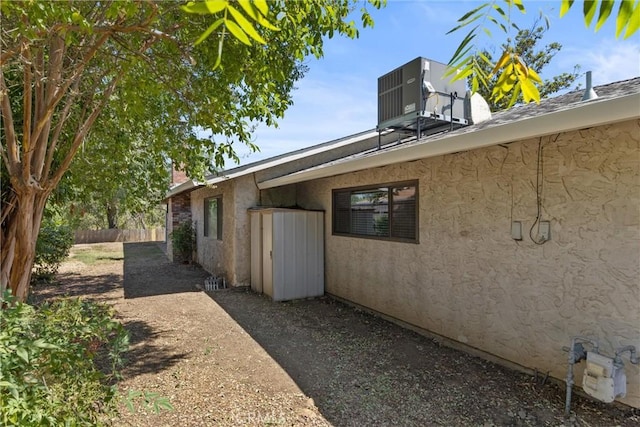 835 Madrone Ave, Chico, CA 95926 - view of home's exterior featuring stucco siding and a central air condition unit