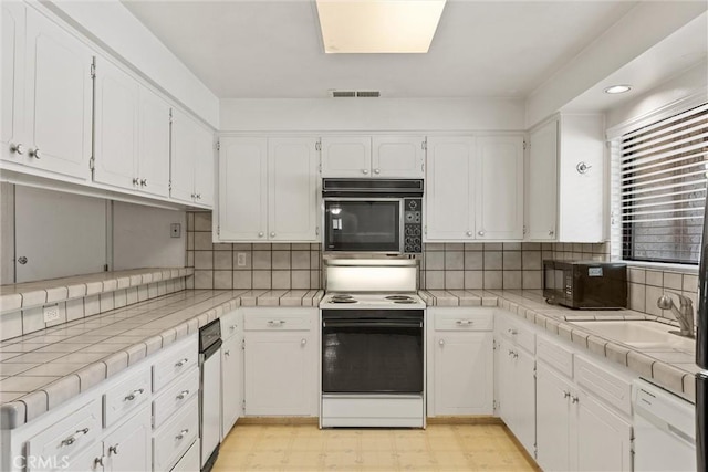 835 Madrone Ave, Chico, CA 95926 - kitchen with white appliances, white cabinetry, light flooring, and recessed lighting