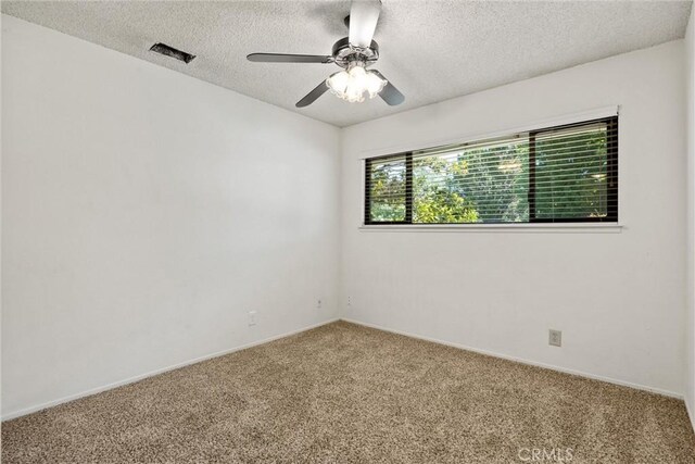 835 Madrone Ave, Chico, CA 95926 - carpeted empty room featuring a textured ceiling and a ceiling fan