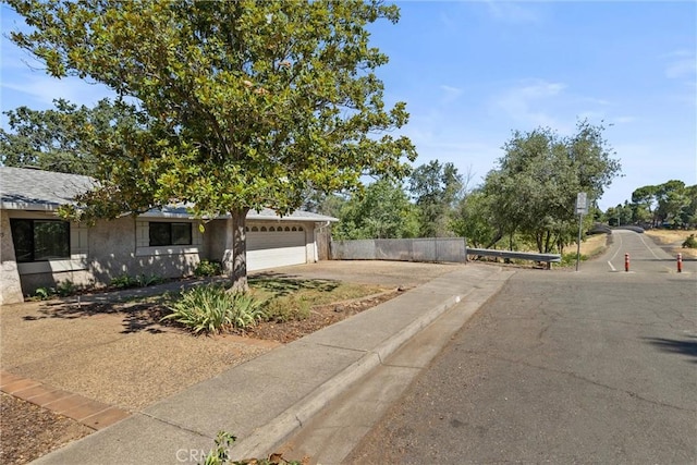 835 Madrone Ave, Chico, CA 95926 - view of front facade featuring a garage, driveway, and stucco siding