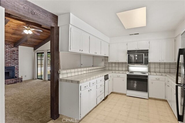 835 Madrone Ave, Chico, CA 95926 - kitchen featuring black appliances, white cabinetry, and backsplash