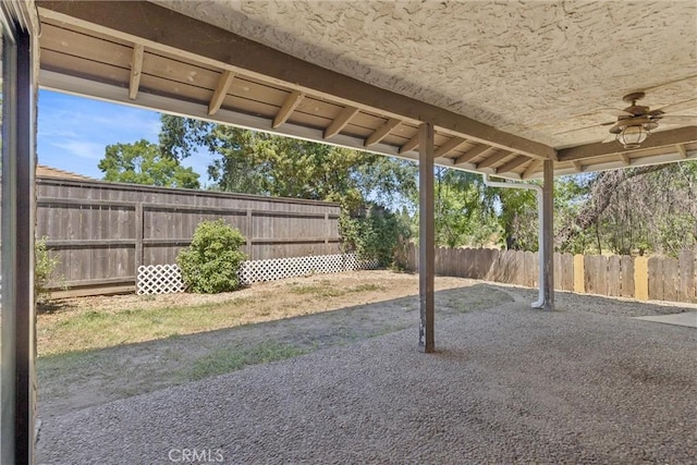 835 Madrone Ave, Chico, CA 95926 - fenced backyard with ceiling fan and a patio area