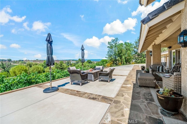 33612 Vino Way, Temecula, CA 92591 - view of patio / terrace with an outdoor living space with a fire pit