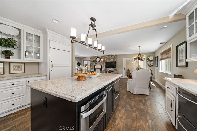 33612 Vino Way, Temecula, CA 92591 - kitchen with white cabinetry, dark wood-type flooring, a kitchen island, appliances with stainless steel finishes, and glass insert cabinets