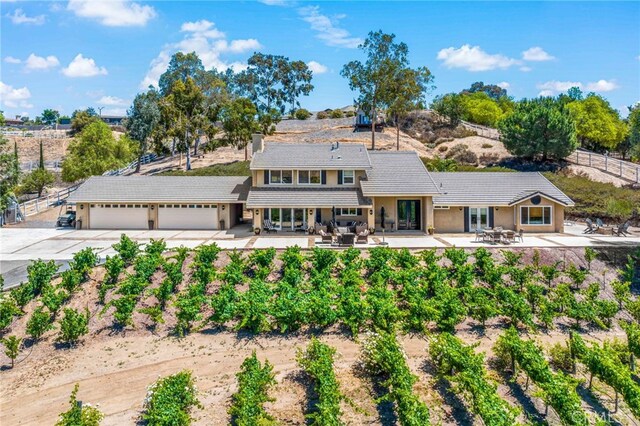 33612 Vino Way, Temecula, CA 92591 - view of front of house featuring driveway, a garage, and a patio area