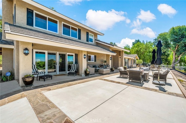 33612 Vino Way, Temecula, CA 92591 - back of house with an outdoor hangout area, stucco siding, and a patio