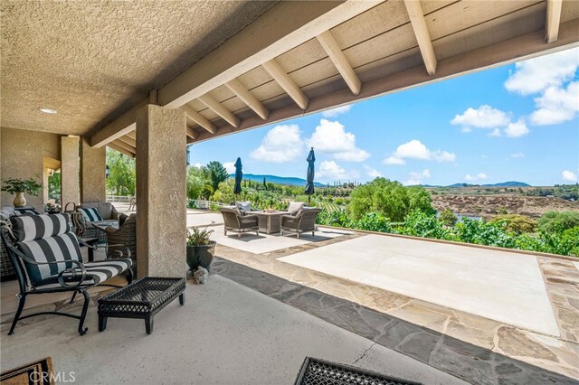 33612 Vino Way, Temecula, CA 92591 - view of patio with an outdoor hangout area and a mountain view